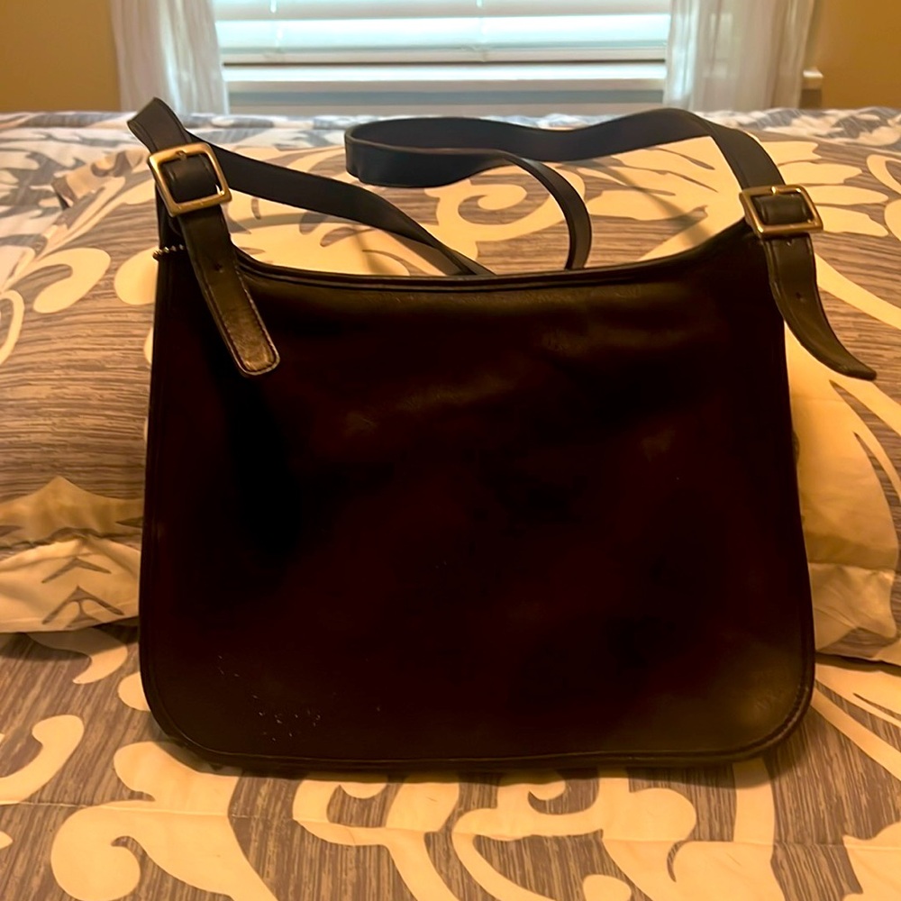 Coach, black leather handbag.